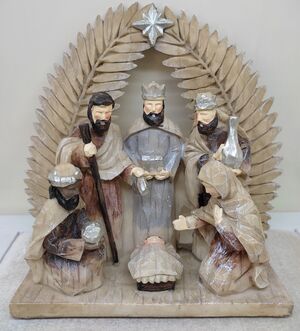 MISTERIO 1PIEZA 17 CM CON REYES DEBAJO DE HOJAS DE PALMA 23/071