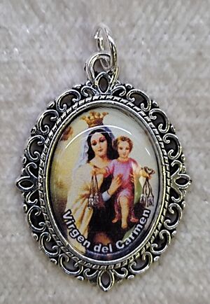 MEDALLA VIRGEN DEL CARMEN ORLA PLATEADA 21X29 MM
