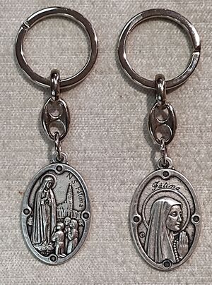 LLAVERO METAL OVAL 32MM DOBLE CARA FATIMA