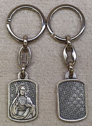 LLAVERO METAL RECTANG/OVAL 30MM SAGRADO CORAZÓN DE JESÚS