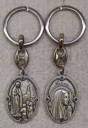 LLAVERO VIRGEN DE FÁTIMA METAL OVAL 32MM DOBLE CARA 