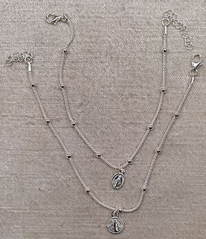 PULSERA 2 BOLAS COLGANTE MILAGROSA O SAN BENITO PLATA PLP-31