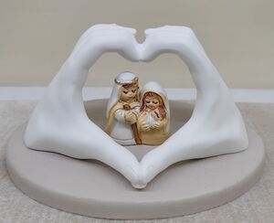 MANOS CON NACIMIENTO EN RESINA 6 CM