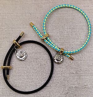 PULSERA CORDÓN ACERO VARIOS COLORES CON CIERRE Y FINALES DORADOS