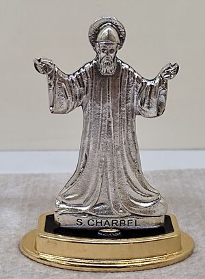 FIGURA SAN CHARBEL PLATEADA 7 CM. C/BASE ESMALTE/ORO 